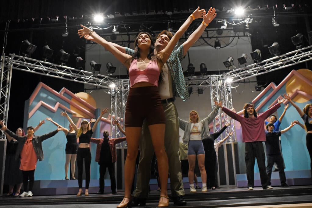 Ileene Christianson-Torres, left, and Max Bohlke-Slater along with fellow cast members during a rehearsal of "The Wedding Singer" in the newly renovated Burbank Auditorium at Santa Rosa Junior College on Saturday, April 9, 2022. (Photo: Erik Castro/for The Press  Democrat)