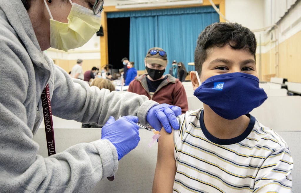 Christoper Mendoza is vaccinated against COVID-19 at a vaccine clinic sponsored by the Sonoma Valley Community Health Center. (robbi pengelly / Sonoma Index-Tribune)