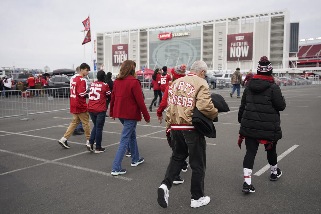 Fans walk toward Levi’s Stadium before a game between the San Francisco 49ers and Los Angeles Rams in Santa Clara, Saturday, Dec. 21, 2019. (Tony Avelar / ASSOCIATED PRESS)