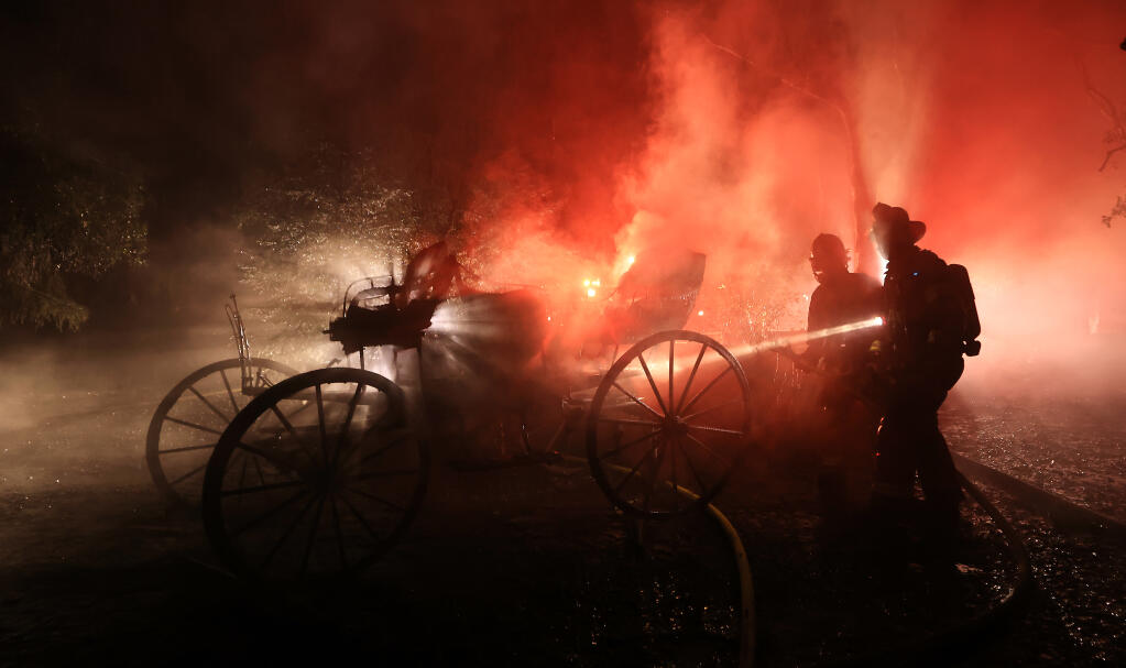 A horse carriage was pulled from the garage of John Jenkel after a fire gutted much of the home, Thursday, Dec. 29, 2022, in Graton. (Kent Porter/The Press Democrat)