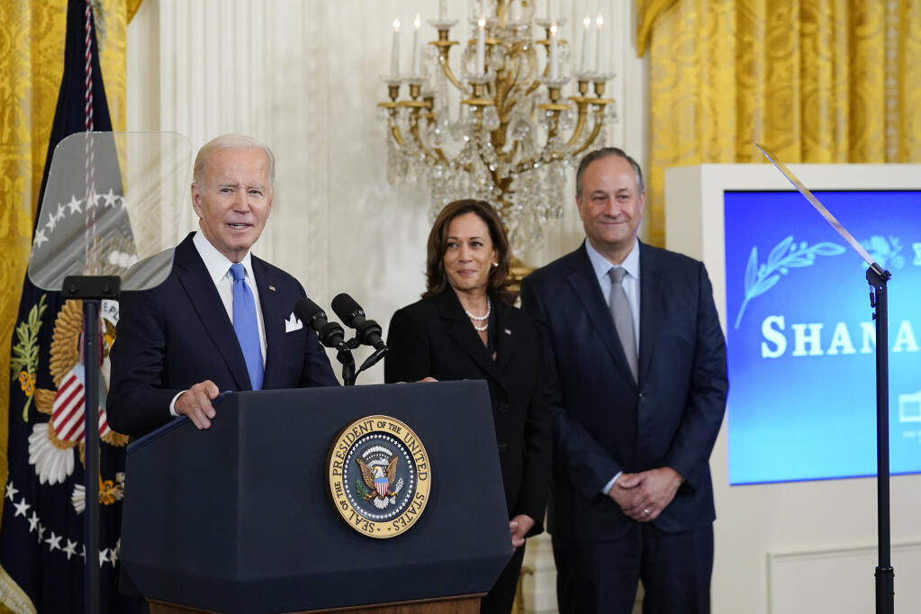 FILE - President Joe Biden speaks during a reception to celebrate the Jewish new year in the East Room of the White House in Washington, Friday, Sept. 30, 2022. Vice President Kamala Harris and her husband Doug Emhoff look on at right. Biden on Thursday, May 25, 2023, announced what he said is the most ambitious and comprehensive undertaking by the U.S. government to fight hate, bias and violence against Jews, outlining more than 100 steps the administration and its partners can take to combat an alarming rise in antisemitism. (AP Photo/Susan Walsh, File)