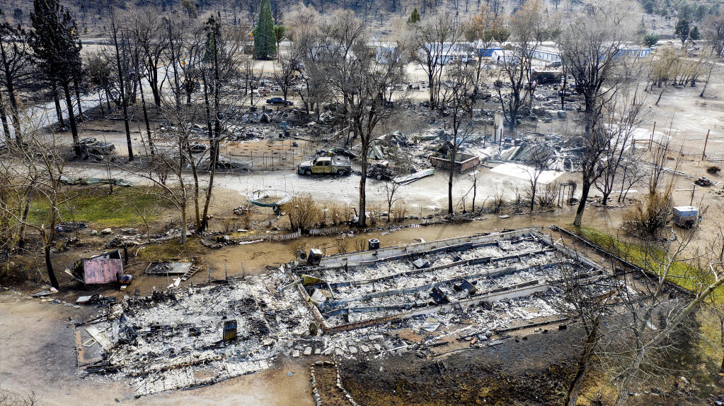 In this photo taken by a drone, homes destroyed by the Mountain View Fire are seen in the Walker community in Mono County, Calif., Wednesday, Nov. 18, 2020. (AP Photo/Noah Berger)