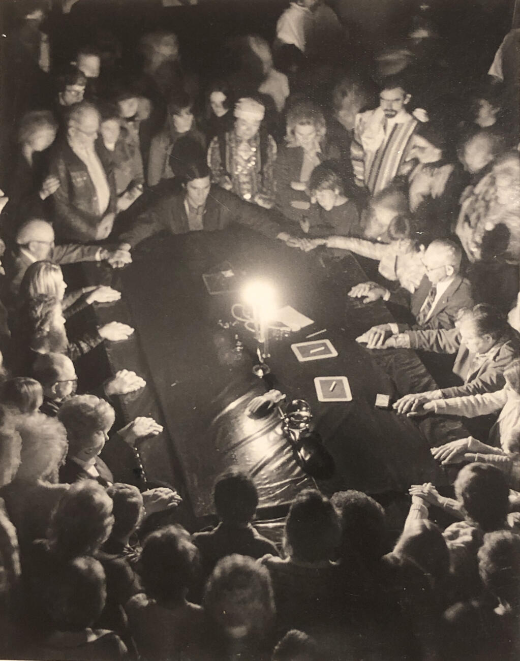 An early undated shot of the Halloween Houdini séance, with Bill Soberanes seated at the table on the right side of the photo. A deck of cards is on the table next to his left hand. (COURTESY OF THE PETALUMA HISTORICAL LIBRARY AND MUSEUM)
