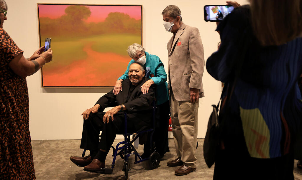 Kathleen and Steve Kiser of Palo Alto, longtime friends with acclaimed artist Richard Mayhew are photographed with Mayhew during the opening of an exhibit titled "Richard Mayhew: Inner Terrain"  at the Sonoma Valley Museum of Art in Sonoma, Saturday, Sept. 23, 2023.  (Kent Porter / The Press Democrat)