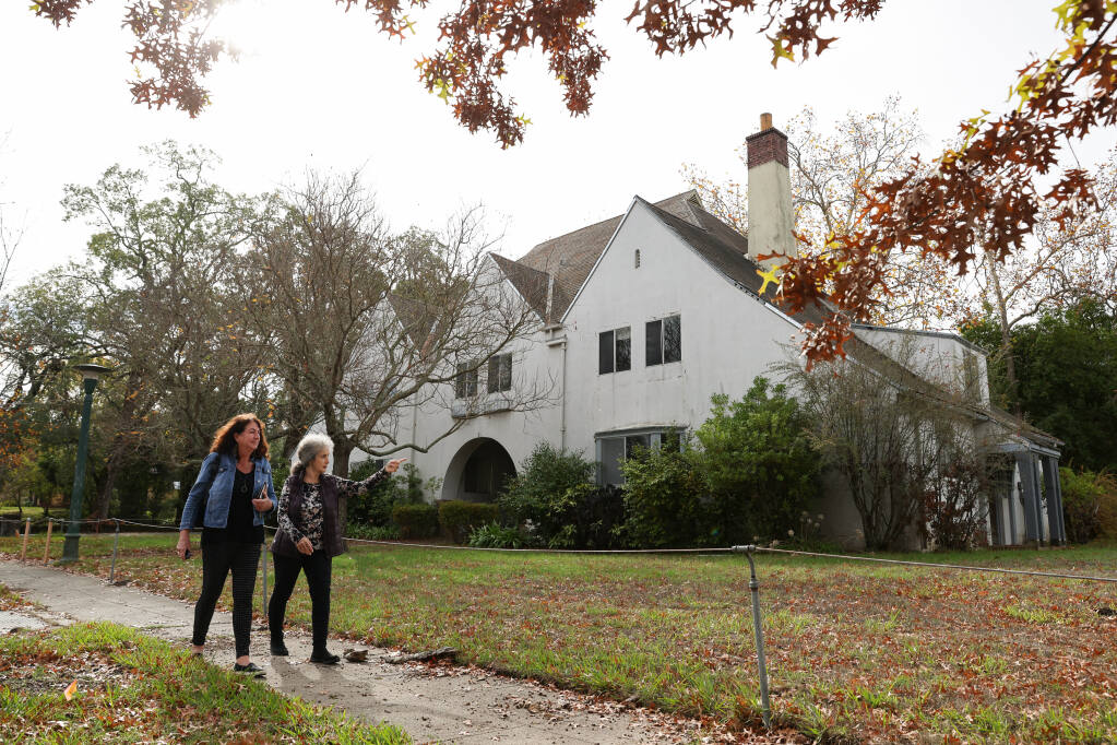 Trish McVey, left, and Vickie Lingron take a walk at the Sonoma Developmental Center campus in Eldridge on Friday, Nov. 5, 2021.  McVey worked at the center for 18 years, and Lingron's brother is a former resident.  (Christopher Chung/ The Press Democrat)