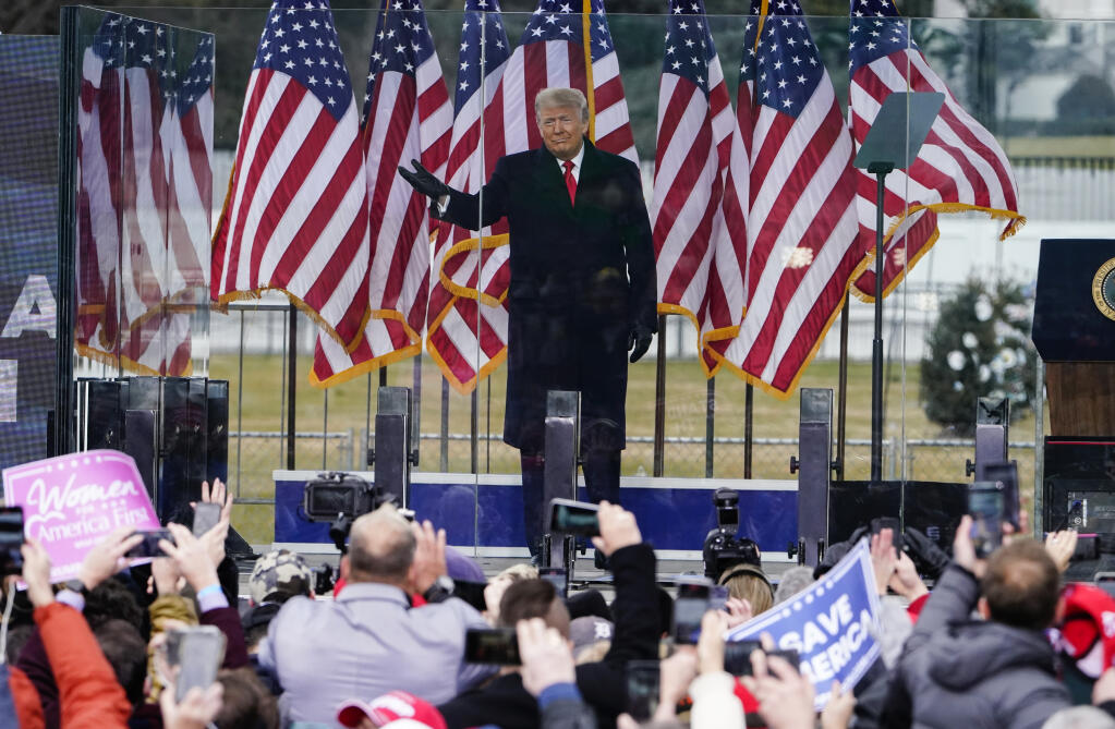 FILE - In this Jan. 6, 2021, photo, President Donald Trump arrives to speak at a rally in Washington. A federal judge on Feb. 18, 2022, rejected efforts by the former president to toss out lawsuits filed by lawmakers and two Capitol police officers, saying in his ruling that the former president's words "plausibly" may have led to the Jan. 6, 2021 insurrection. (AP Photo/Jacquelyn Martin, File)