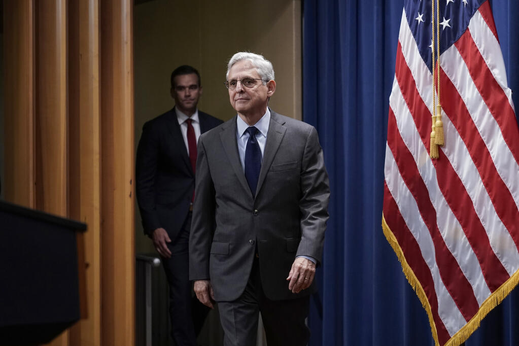 Attorney General Merrick Garland arrives to speak to reporters and to announce charges against two men suspected of being Chinese intelligence officers for attempting to obstruct a U.S. criminal investigation and prosecution of Chinese tech giant Huawei, at the Department of Justice in Washington, Monday, Oct. 23, 2022. (AP Photo/J. Scott Applewhite)