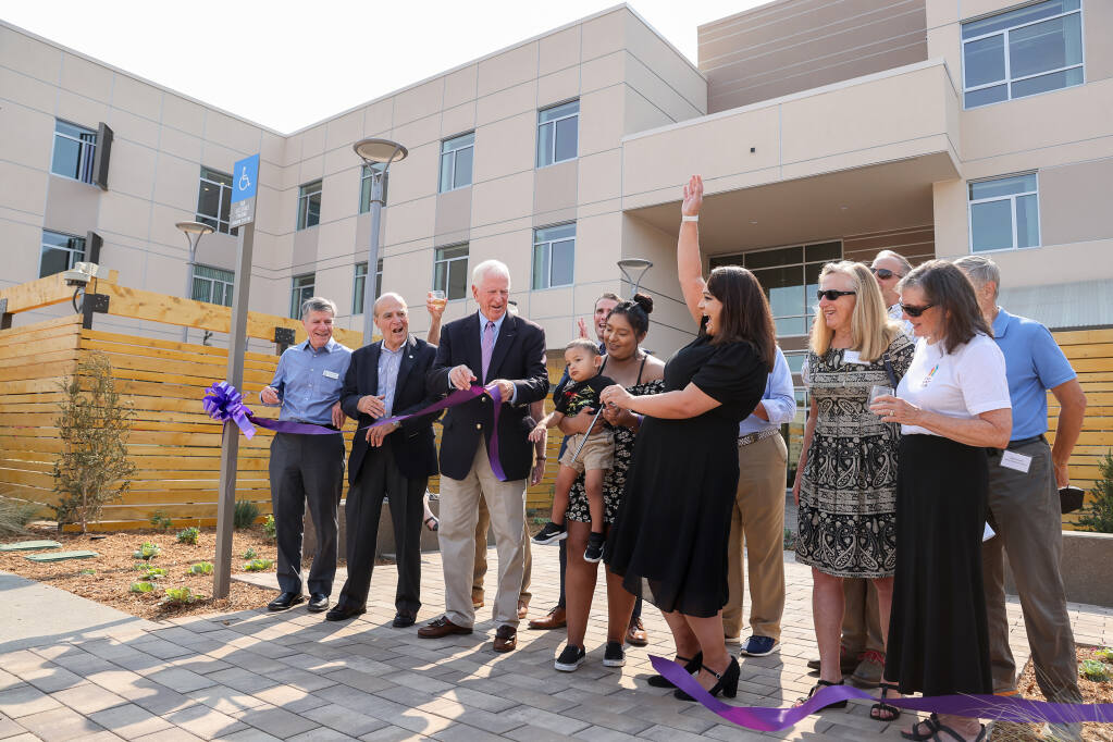 A ribbon cutting marks the opening of the Caritas Center in downtown Santa Rosa. (CHRISTOPHER CHUNG / The Press Democrat)