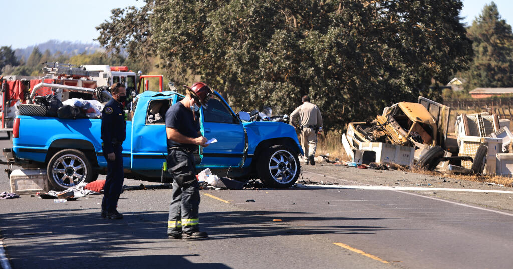 Drivers of a blue pickup and a flatbed winery truck collided on Highway 12 near Llano Road, Wednesday, Sept. 29, 2021, killing the driver of the pickup.  (Kent Porter / The Press Democrat)