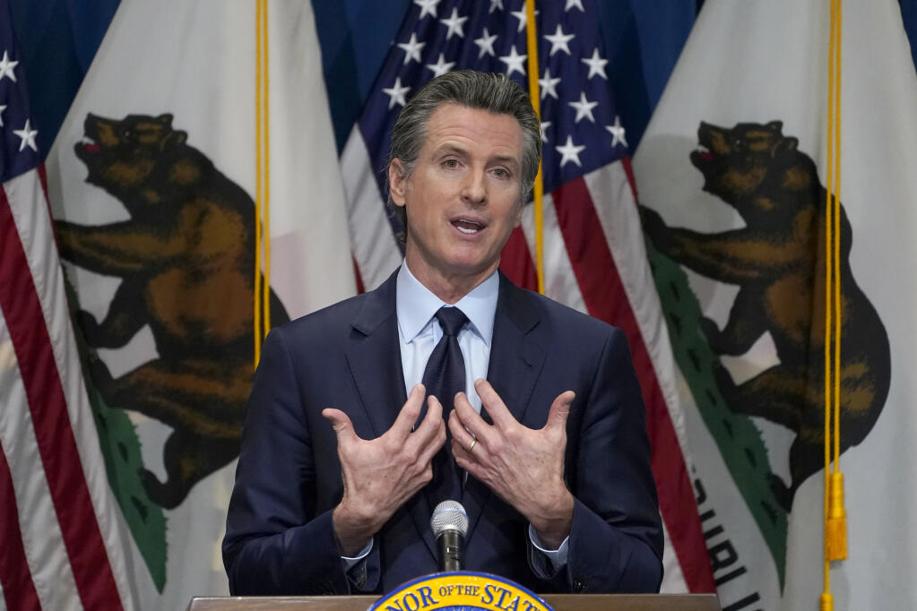 FILE - In this Jan. 8, 2021, file photo, California Gov. Gavin Newsom gestures during a news conference in Sacramento, Calif. Gov. Newsom is facing the possibility that he could be removed by voters in a recall election later this year, in the midst of his four-year term. (AP Photo/Rich Pedroncelli, Pool, File)