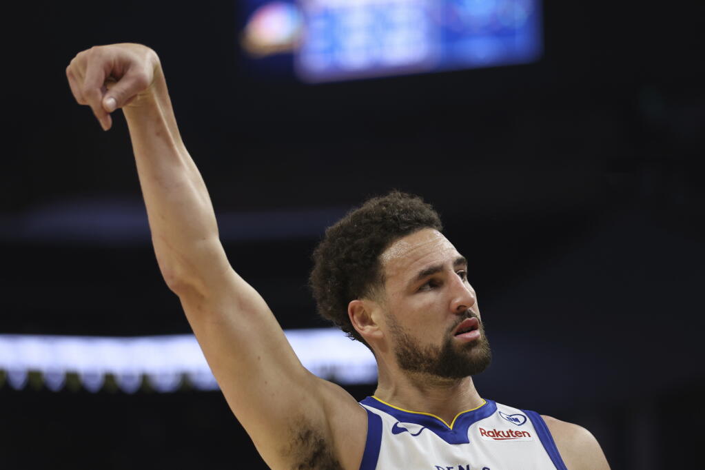 Golden State Warriors guard Klay Thompson reacts after making a three-point basket Sunday against the Utah Jazz in San Francisco. (Jed Jacobsohn / ASSOCIATED PRESS)