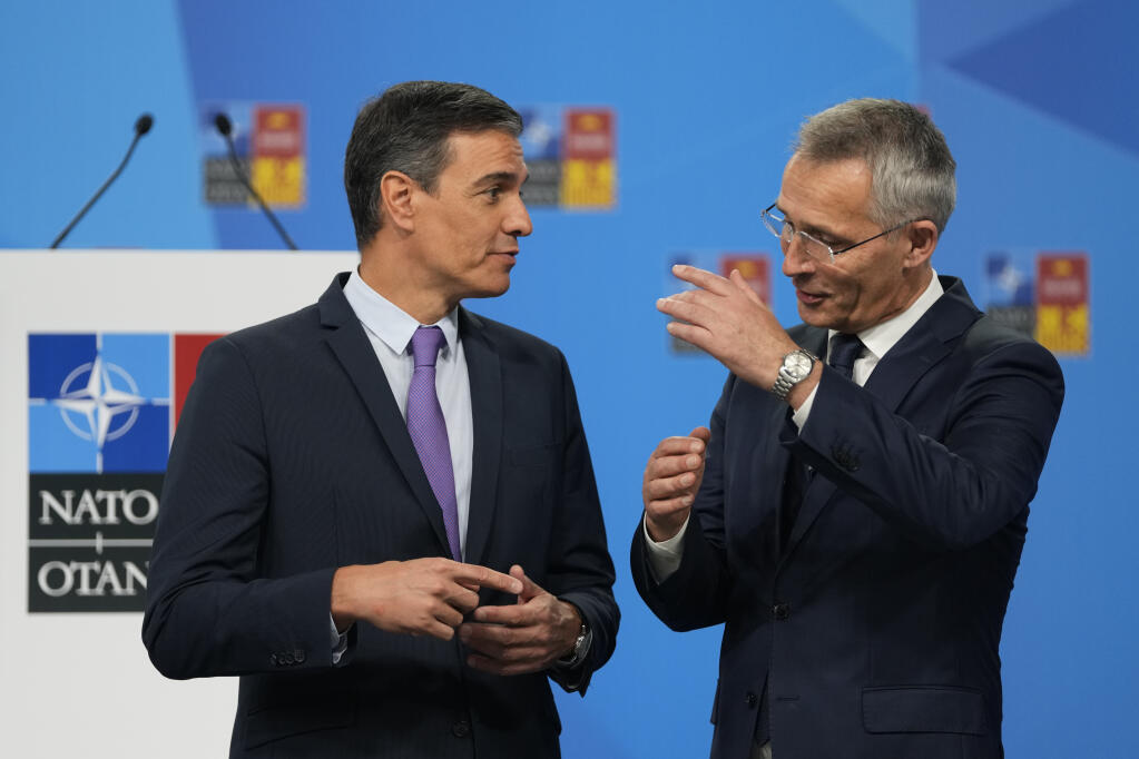 NATO Secretary General Jens Stoltenberg, right, talks with Spanish Prime Minister Pedro Sanchez at the NATO summit venue in Madrid, Spain on Tuesday, June 28, 2022. North Atlantic Treaty Organization heads of state will meet for a NATO summit in Madrid from Tuesday through Thursday. (AP Photo/Manu Fernandez)