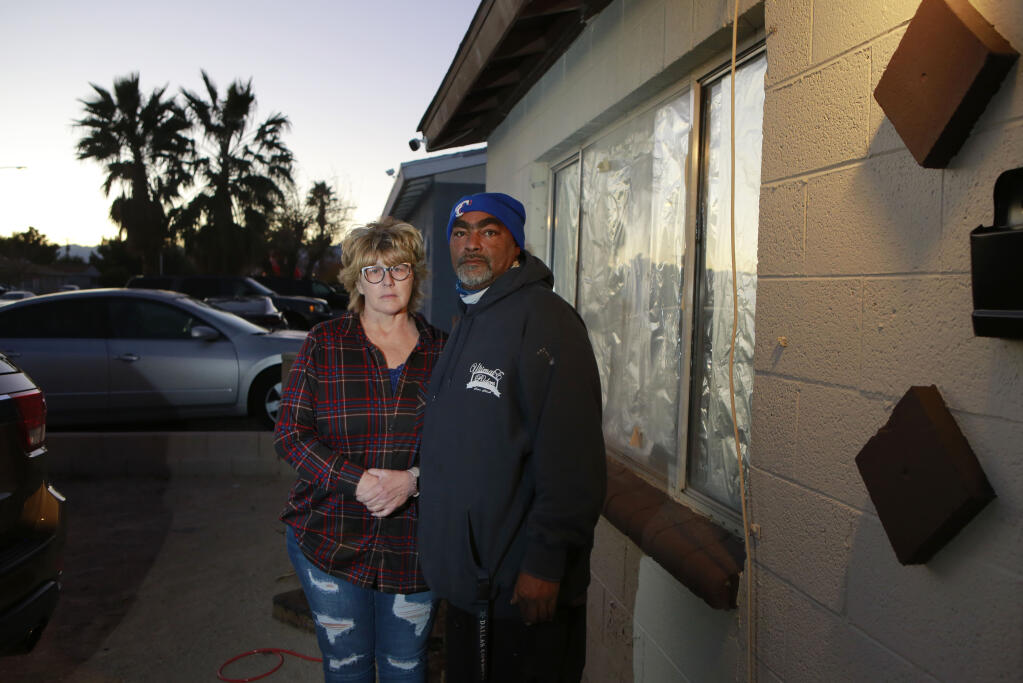 Othello Morris, right, stands with is partner Tammy Austin outside their rental home Friday, Dec. 17, 2021, in North Las Vegas. The couple has been struggling with their landlord real estate developer Eddie Haddad, who is set to buy the county’s 72-acre Chanate Road campus in Santa Rosa. (Ronda Churchill for the Press Democrat)