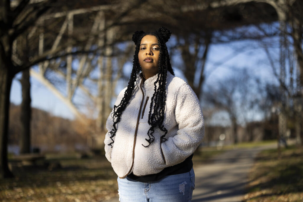 High school student Mecca Patterson-Guridy, 17, poses for a portrait in Philadelphia, Friday, Dec. 9, 2022. Scrutiny from conservatives around teaching about race, gender and sexuality has made many teachers reluctant to discuss issues that touch on cultural divides. To fill in gaps, some students, including Mecca, are looking to social media, where online personalities, nonprofit organizations and teachers are experimenting with ways to connect with them outside the confines of school. (AP Photo/Ryan Collerd)