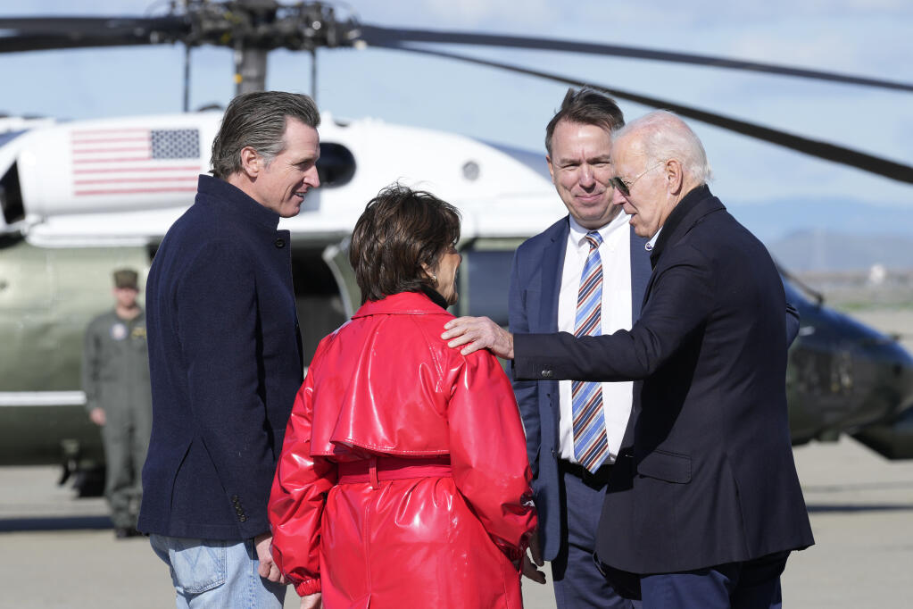 President Joe Biden greets Rep. Anna Eshoo, D-Calif., California Gov. Gavin Newsom, left, and David Korsmeyer, associate center Director for Research and Technology, National Aeronautics and Space Administration (NASA), after arriving on Air Force One at Moffett Federal Airfield in Mountain View, Calif., Thursday, Jan 19, 2023. (AP Photo/Susan Walsh)