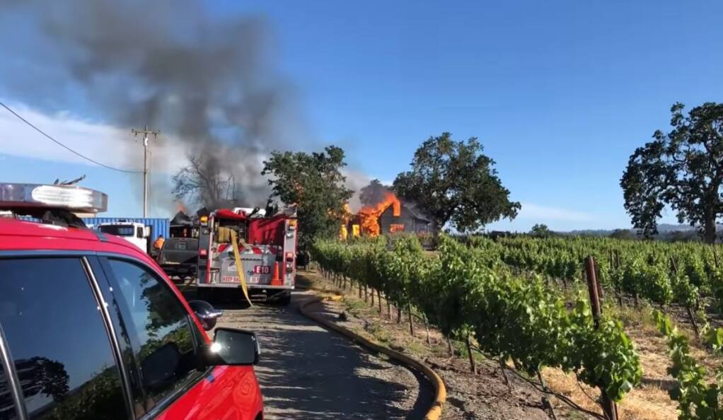 A screenshot from video showing emergency crews battling a house fire west of Santa Rosa on Hall Road, Monday, June 7, 2021. (Santa Rosa Fire Department)