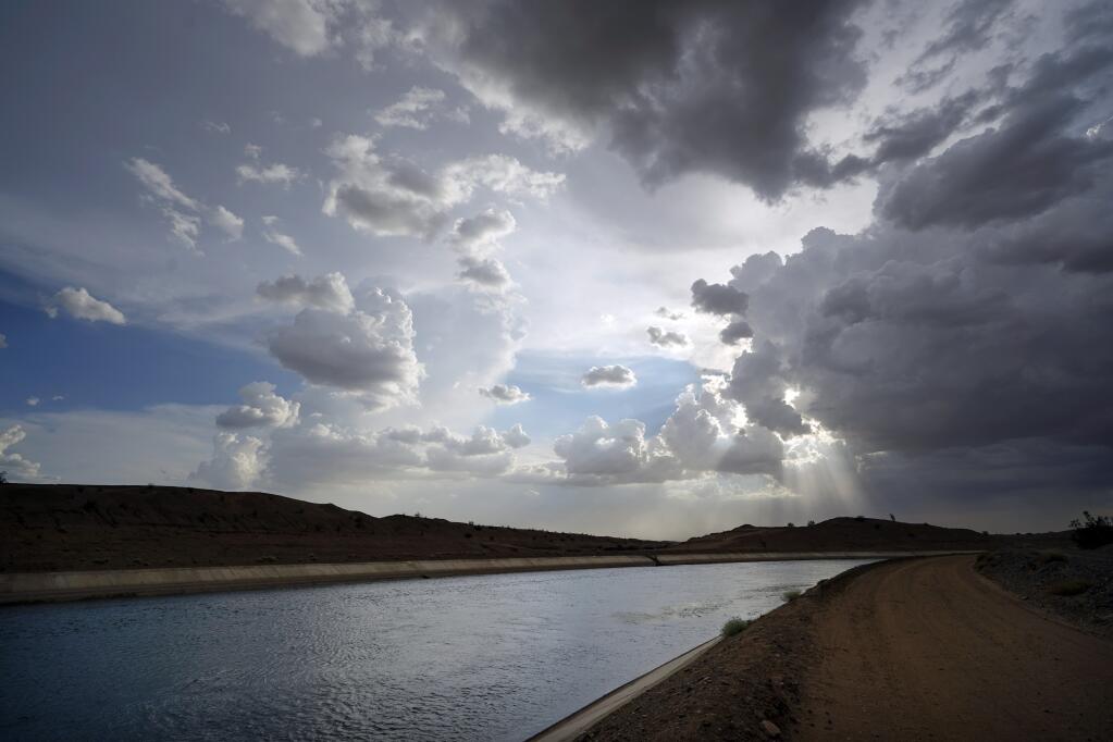 FILE - Water flows along the All-American Canal Saturday, Aug. 13, 2022, near Winterhaven, Calif. (AP Photo/Gregory Bull, File)