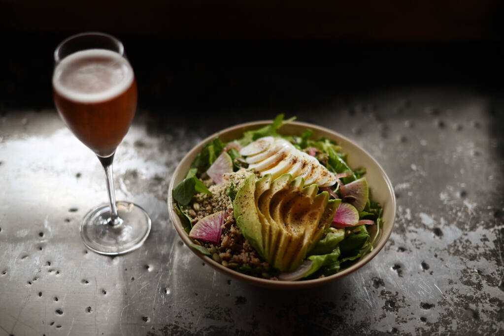 The power bowl, a salad with avocado, hemp seeds, quinoa and roasted butternut squash is dressed with a fig-apple-cider vinaigrette at Agriculture Public House at Dawn Ranch in Guerneville. (Erik Castro/For The Press Democrat)