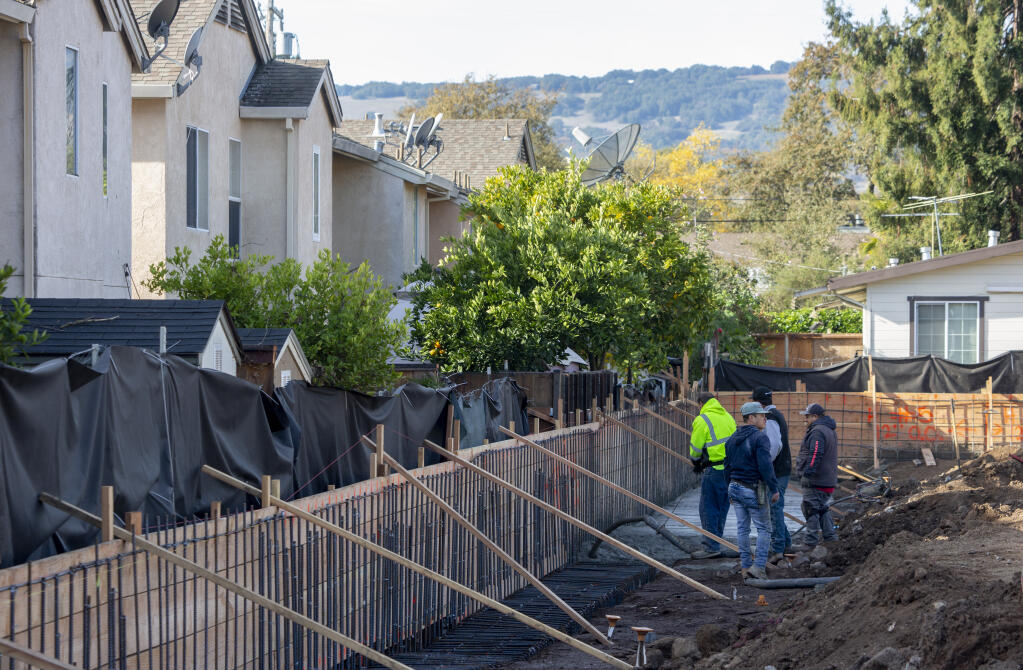 Cement is poured for the retaining wall at the Homeless Action Sonoma (HAS) site on Highway 12 in Boyes Hot Springs on Monday, Nov. 21, 2022. (Robbi Pengelly/Index-Tribune)