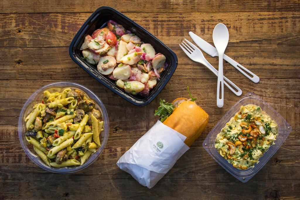 From left, Curry Chicken Salad, Pesto Penne Pasta Salad with roasted veggies, Tri-tip Sandwich with Pt. Reyes Blue, cartelized onions and arugula, and German Potato Salad from the to-go case at A La Heart Kitchen in Forestville Friday, July 1, 2022. (John Burgess / The Press Democrat)