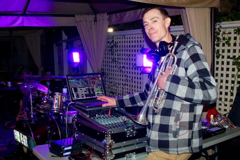 Joshua “Bluegreen” Cripps DJing at a holiday event in Santa Rosa in 2021. He also played trumpet for the Tahoes, a Sonoma County reggae-rock band. (Cripps family)