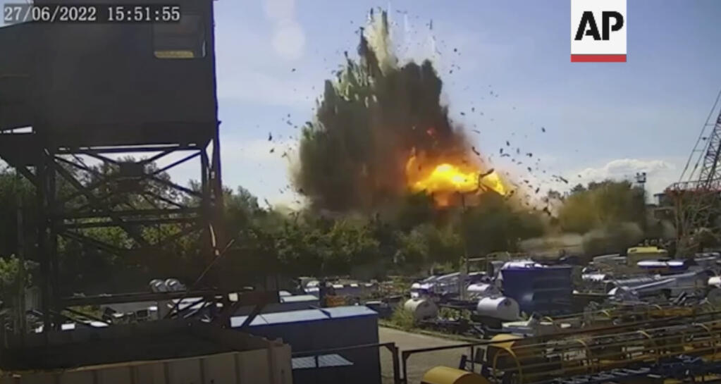 In this image taken from video and provided by the Ukrainian Presidential Press Office on Tuesday, June 28, 2022 which claims to show the moment just after a missile struck the shopping mall in Kremenchuk, Ukraine. (Ukrainian Presidential Press Office via AP)