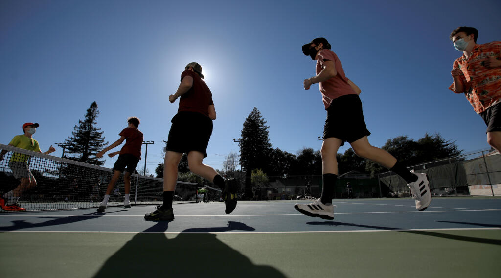 The Analy High School's boys tennis team take laps prior to the start of their practice, Tuesday, Feb. 23, 2021 in Sebastopol.  (Kent Porter / The Press Democrat) 2021