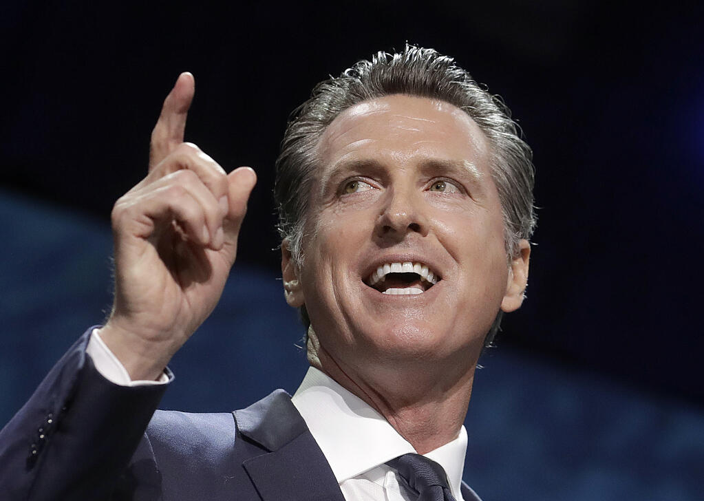 FILE - In this June 1, 2019, file photo, Gov. Gavin Newsom speaks during the 2019 California Democratic Party State Organizing Convention in San Francisco. (AP Photo/Jeff Chiu, File)
