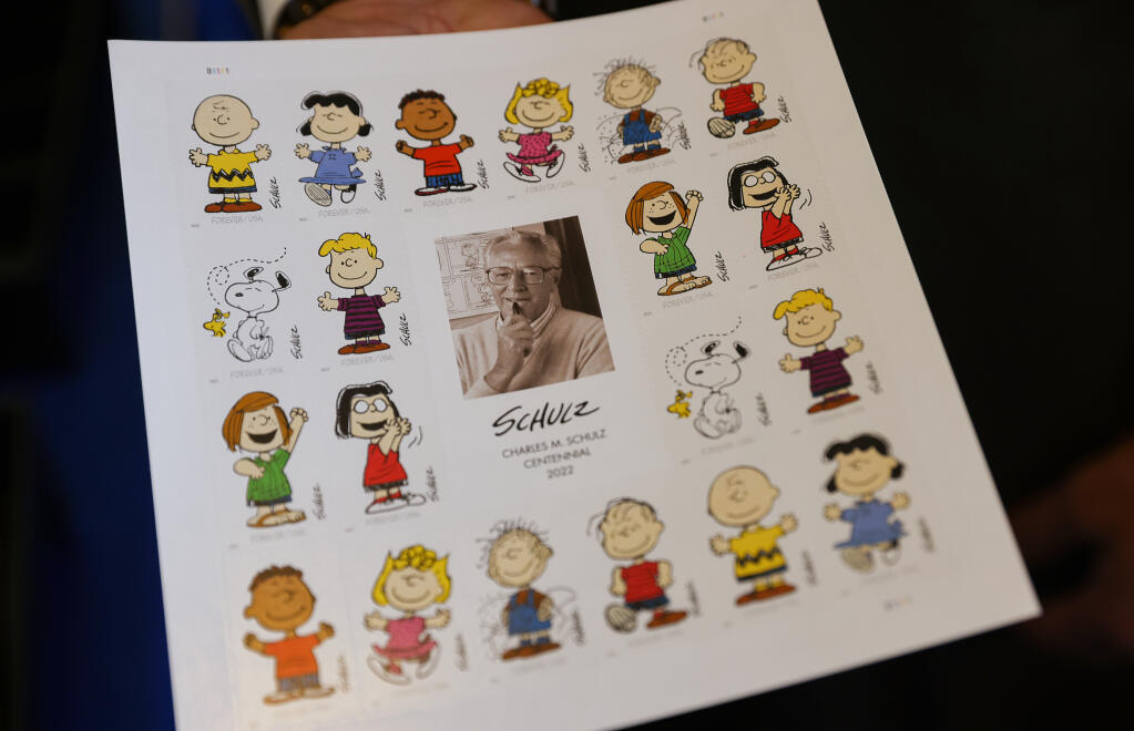 A sheet of "forever" stamps commemorating the birth centennial of cartoonist Charles M. Schulz in Santa Rosa, Friday, Sept. 30, 2022. (Christopher Chung / The Press Democrat file)
