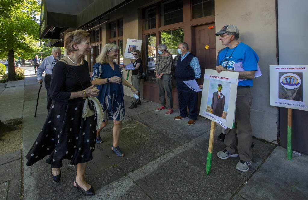 As art patrons gathered for the opening of the newest exhibition at the Sonoma Valley Museum of Art, they were greeted by union activists on Saturday, May 14, 2022. (Robbi Pengelly/Index-Tribune)