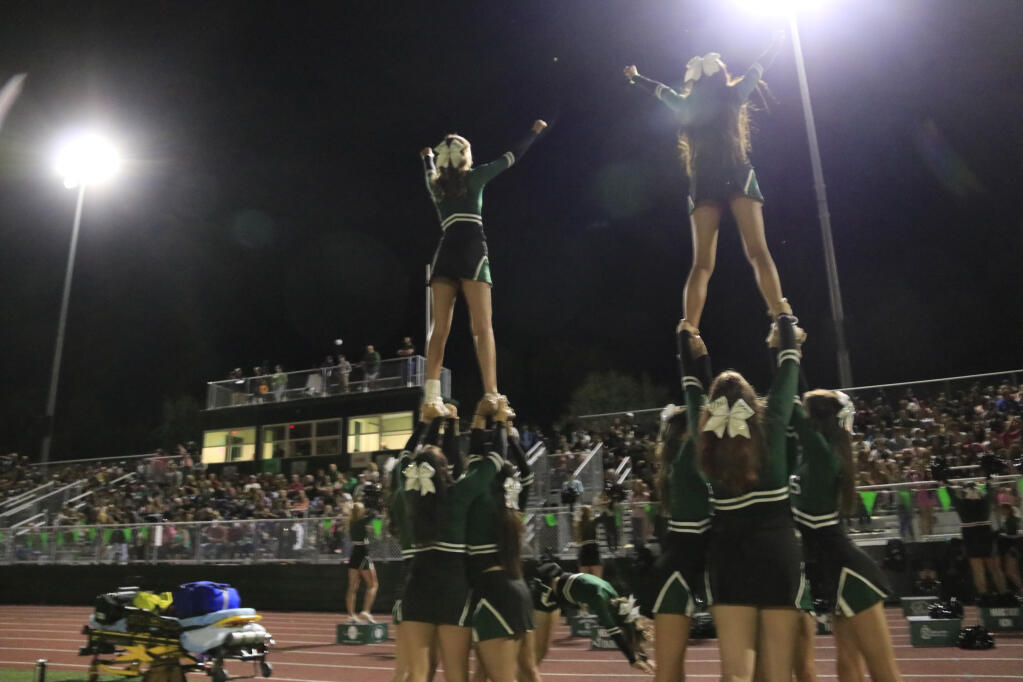 Sonoma Valley High's varsity cheer team rallies the hometown crowd as the second half begins in the Oct. 1, 2021 game against Homecoming rival Justin-Siena. (Christian Kallen/Index-Tribune)