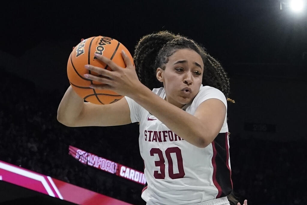 Stanford’s Haley Jones grabs a rebound during the second half against UConn in the semifinal round of last year’s Women’s Final Four in Minneapolis. (Charlie Neibergall / ASSOCIATED PRESS)
