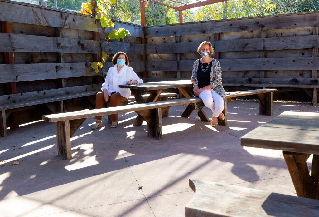 Sebastopol Center for the Arts managing director Una Glass, left, and creative director Catherine Devriese pose for a portrait at one of the center's outdoor patios where supervised distance learning will be provided for young students, at Sebastopol Center for the Arts in Sebastopol, California, on Tuesday, Oct. 27, 2020. (Alvin A.H. Jornada / The Press Democrat)