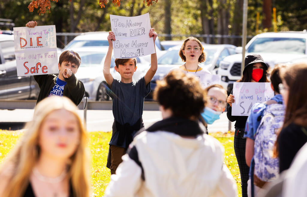 Students from Spring Lake Middle School and Slater Middle School walked out at lunchtime and marched to Montgomery High School to join students for a rally in Santa Rosa against school violence, Wednesday, March 8, 2023.  (John Burgess / The Press Democrat)
