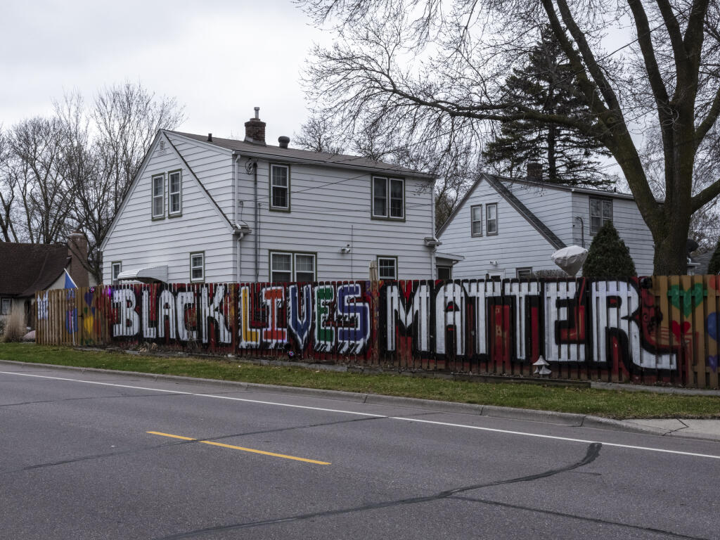 A Black Lives Matter mural painted after the death of George Floyd by homeowners in West St. Paul, Minnesota, seen here in April 2021. It was later painted over to comply with city ordinances that prohibit fences from being more than one color or from displaying words, pictures or signs. (JOSHUA RASHAAD McFADDEN / New York Times)