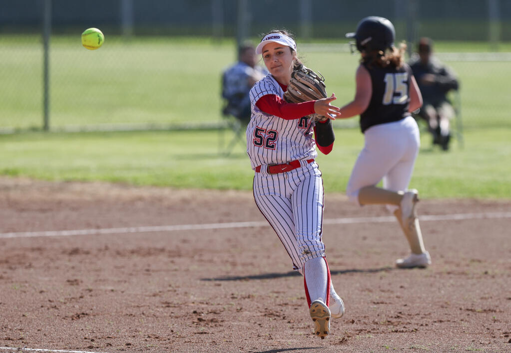 Rancho Cotate’s Tiare Guerrero makes the throw to first base after fielding a ground ball against Windsor in Rohnert Park on Tuesday, April 19, 2022. (Christopher Chung / The Press Democrat)