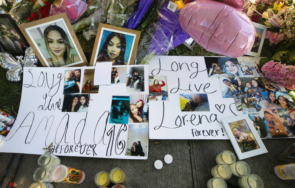 A memorial was created at the corner of Golf Course Drive and Roberts Lake Road in Rohnert Park for Lorena Recendez-Martinez, 17,  and Amada Guadalupe Salinas-Agular, 16, who died in a single car crash on Saturday.   (Photo by John Burgess/The Press Democrat)