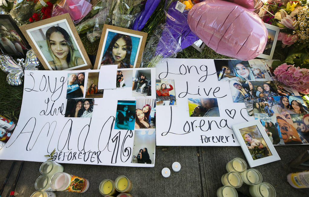 A memorial was created at the corner of Golf Course Drive and Roberts Lake Road in Rohnert Park for Lorena Recendez-Martinez, 17,  and Amada Guadalupe Salinas-Agular, 16, who died in a single car crash on Saturday.   (Photo by John Burgess/The Press Democrat)
