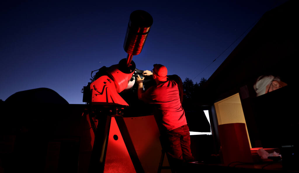 A Robert Ferguson Observatory telescope is given last minute adjustments prior to Public Star Party at Sugarloaf State Park, Saturday, Sept. 25, 2021 near Kenwood.   (Kent Porter / The Press Democrat) 2021