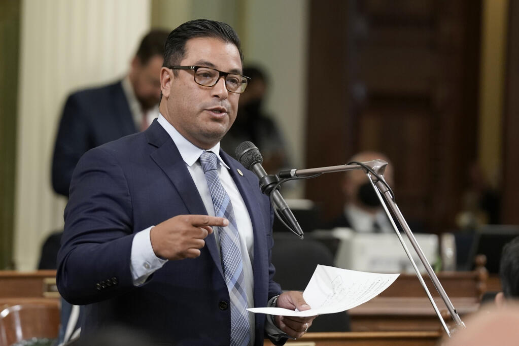 FILE - Assemblyman Carlos Villapudua, D-Stockton, talks during the Assembly session in Sacramento, Calif., on June 30, 2022. Villapudua's bill to impose harsher penalties for dealers for possession more than one kilogram of fentanyl was among 16 fentanyl-related bill passed in the Assembly and Senate this past week ahead of a critical deadline on Friday, June 2, 2023. (AP Photo/Rich Pedroncelli, File)