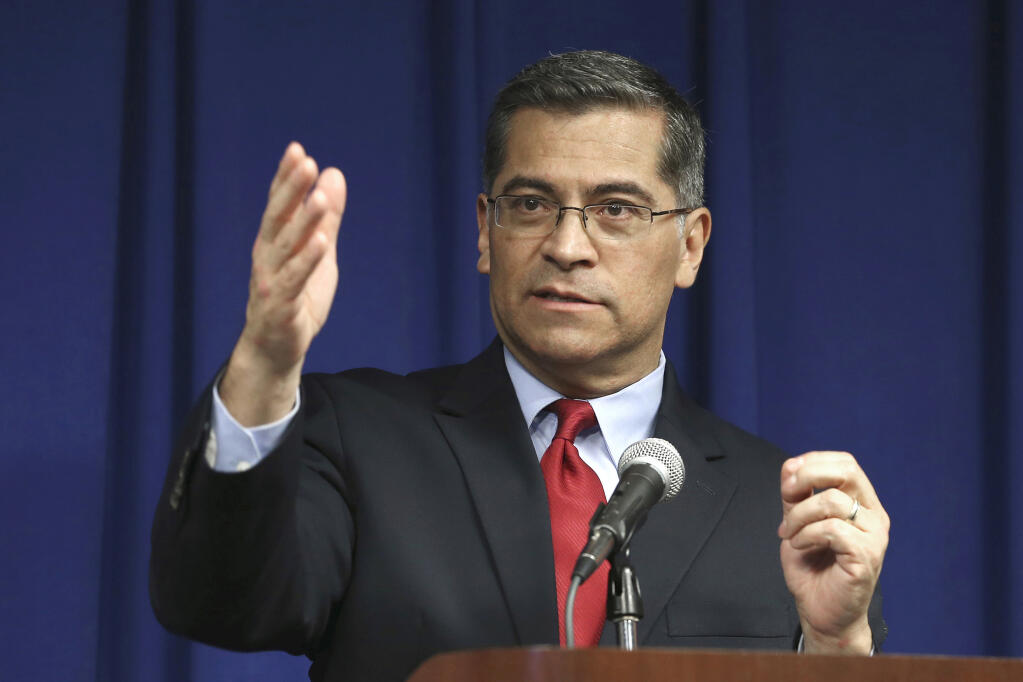 FILE - In this March 5, 2019, file photo, California Attorney General Xavier Becerra speaks during a news conference in Sacramento, Calif.  Becerra on Monday, June 22, 2020, added Idaho to a list of 11 other states where state-funded travel isn't allowed because he determined that they violate a California law. That 2017 law is intended to guard against discrimination based on sexual orientation, gender identity or gender expression. (AP Photo/Rich Pedroncelli, File)