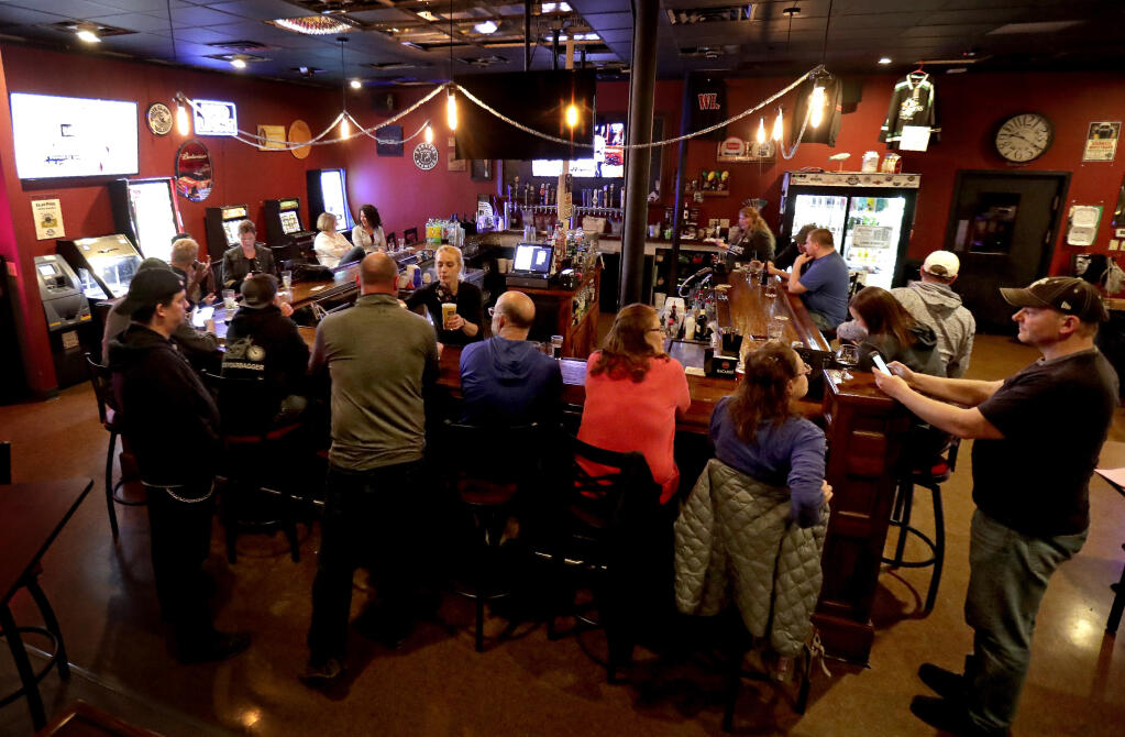FILE - In this May 13, 2020 file photo, The Dairyland Brew Pub opens to patrons in Appleton, Wis. A Wisconsin judge on Monday, Oct. 19, 2020 reimposed an order from Gov. Tony Evers’ administration limiting the number of people who can gather in bars, restaurants and other indoor venues to 25% of capacity. (William Glasheen/The Post-Crescent via AP File)