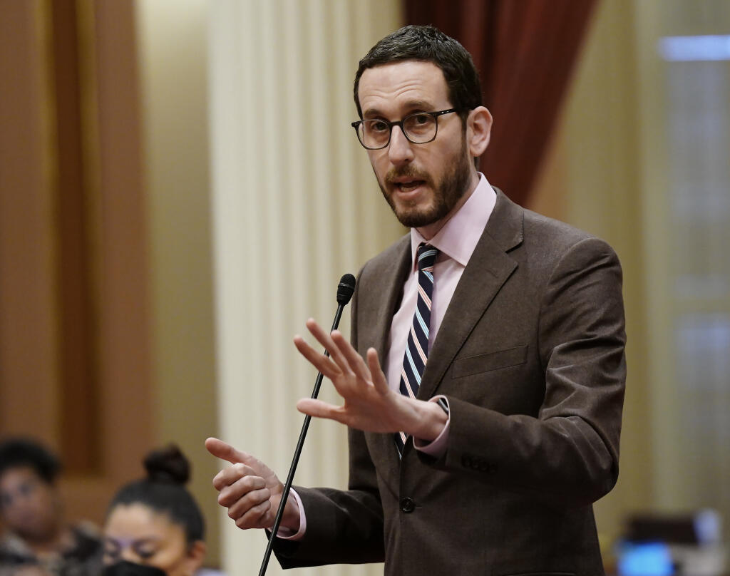 FILE - California state Sen. Scott Wiener, D-San Francisco, speaks on a measure at the Capitol in Sacramento, Calif., on March 31, 2022. On Friday, July 1, 2022, Gov. Gavin Newsom signed Wiener's bill that bars police from making arrests on a charge of loitering for prostitution. (AP Photo/Rich Pedroncelli, File)