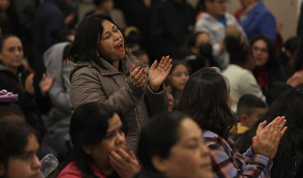 Parishioners sing at Resurrection Catholic Church in Santa Rosa, Friday, Dec. 17, 2022, at the beginning of Las Posadas, a traditional Mexican holiday that dates back to the Middle Ages.  (Kent Porter / The Press Democrat) 2022