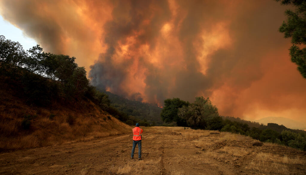 The Hennessey fire approaches Turtle Rock, Tuesday, August 18, 2020 near Lake Berryessa. (Kent Porter / The Press Democrat) 2020