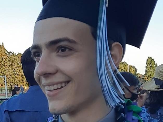 Aidan Clune, 19, pictured in a cap and gown at a graduation ceremony. Clune has been missing in the eastern Nevada wilderness since April 27, and a vigil is planned at Sonoma Plaza at 8 p.m. on Friday. (Photo courtesy of Amy Clune)