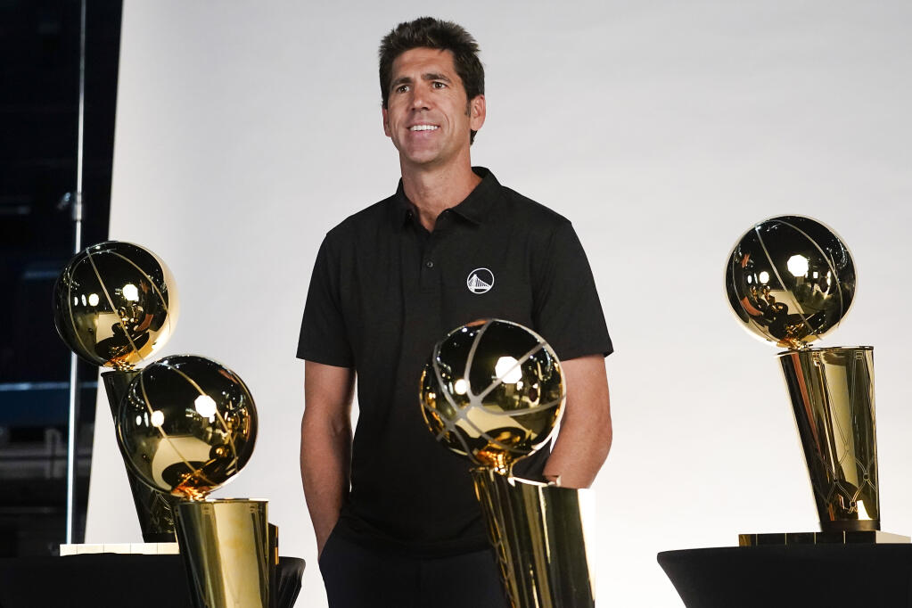 FILE - Golden State Warriors general manager Bob Myers poses for a photograph during an NBA basketball media day in San Francisco, Sunday, Sept. 25, 2022. Myers is departing as president and general manager of the Warriors after building a championship team that captured four titles in an eight-year span and reached five straight NBA Finals from 2015-19. (AP Photo/Godofredo A. Vásquez, File)
