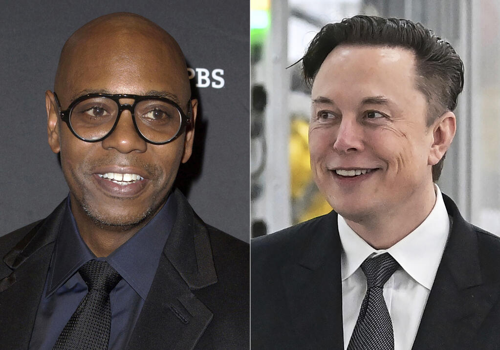 This combination of photos shows comedian Dave Chappelle attending the 22nd Annual Mark Twain Prize for American Humor in Washington on Oct. 27, 2019, left, and businessman Elon Musk at the opening of the Tesla factory Berlin Brandenburg in Gruenheide, Germany, on March 22, 2022. After Chappelle's show on Sunday at the Chase Center in San Francisco, the comedian invited the billionaire on stage. Musk obliged, wearing an “I Love Twitter” T-shirt. Loud boos filled the arena – along with some cheers, too. (AP Photo)