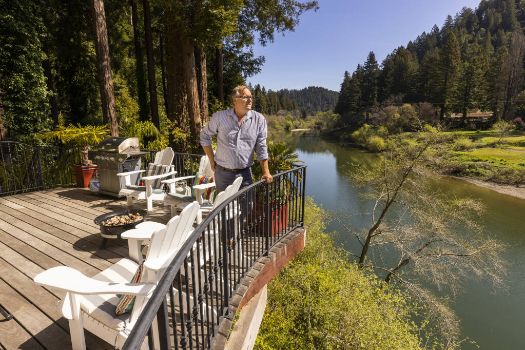 Frederik Norgaard stands on the deck of his rental property on the Russian River in Monte Rio on Wednesday, March 15, 2022. Norgaard owns two rental properties and is upset the Sonoma County Planning Commission will consider a revised vacation rental ordinance for the unincorporated county. (John Burgess/The Press Democrat)