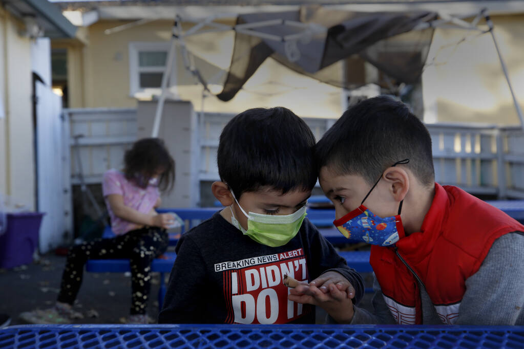 Friends Isaac Alcazar, 4, and Isaiah Torres, 5, share a moment together at A Special Place Therapeutic Preschool in Santa Rosa, Calif., on Monday, November 30, 2020. Photo taken (BETH SCHLANKER/ The Press Democrat)
